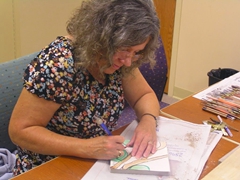 Eileen  - Administrator in charge of the child advocacy center, making a tile