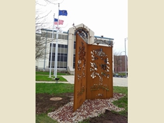 Growing Through the Changes sculpture in front of the Muncie City Building.