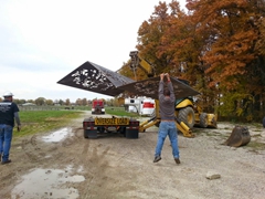Placing the sculpture on the truck for the trip to its final location.